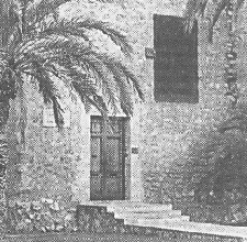 Image: Palm tree shades steps in front of old stone house
