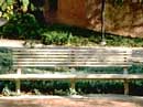 impressionistic painting of park bench
