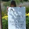 photo of grade-schooler with sign,