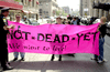 marchers in Boston hold ND banner.